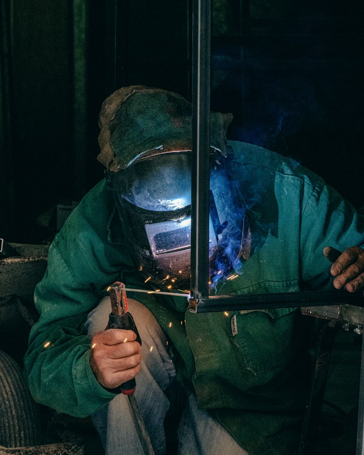 Welder joining a steel frame